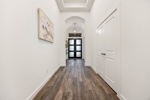23603 Bottlebrush Terrace Trl, Katy, TX 77493 - entryway featuring arched walkways, french doors, dark wood-style floors, and baseboards