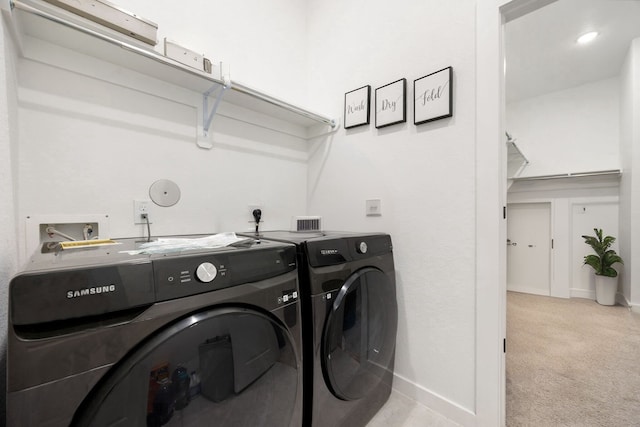 23603 Bottlebrush Terrace Trl, Katy, TX 77493 - laundry area with washing machine and clothes dryer, light carpet, and baseboards