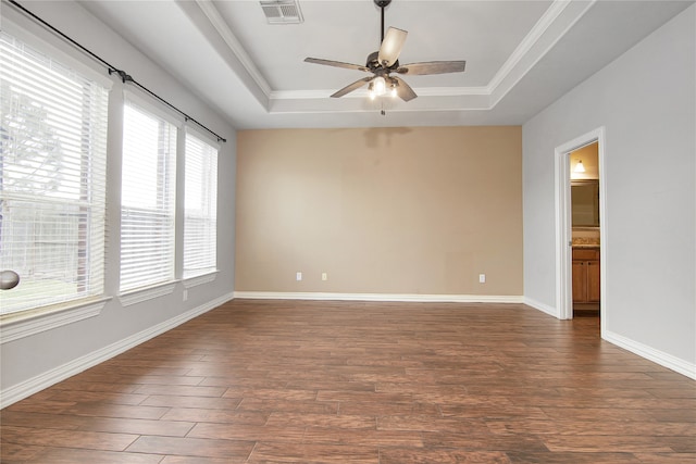 3014 Brahman Dr, Manvel, TX 77578 - spare room with a raised ceiling, ceiling fan, dark wood-type flooring, baseboards, and ornamental molding