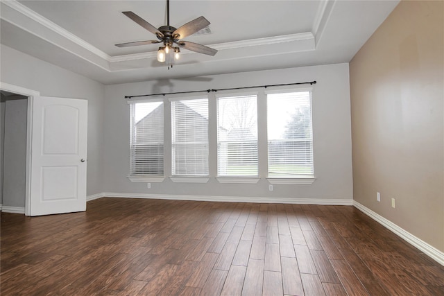 3014 Brahman Dr, Manvel, TX 77578 - spare room featuring a raised ceiling, healthy amount of natural light, dark wood-style floors, and ornamental molding