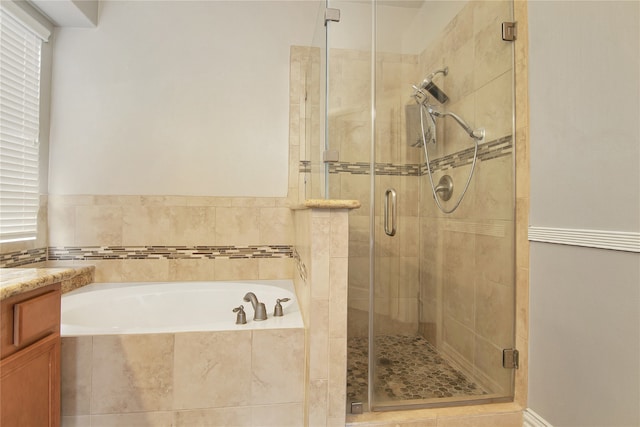 3014 Brahman Dr, Manvel, TX 77578 - full bath featuring a garden tub, a shower stall, and vanity
