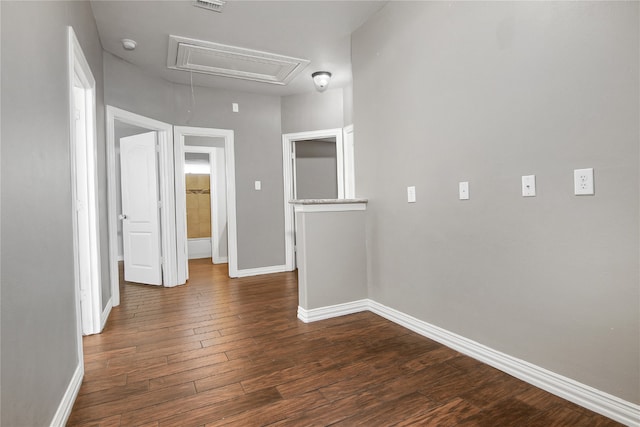 3014 Brahman Dr, Manvel, TX 77578 - unfurnished room featuring attic access, dark wood-style floors, and baseboards