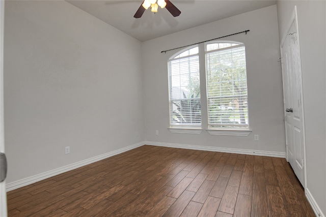 3014 Brahman Dr, Manvel, TX 77578 - spare room featuring dark wood-style floors, ceiling fan, and baseboards