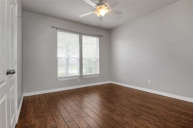3014 Brahman Dr, Manvel, TX 77578 - unfurnished room featuring plenty of natural light, dark wood-style floors, baseboards, and a ceiling fan