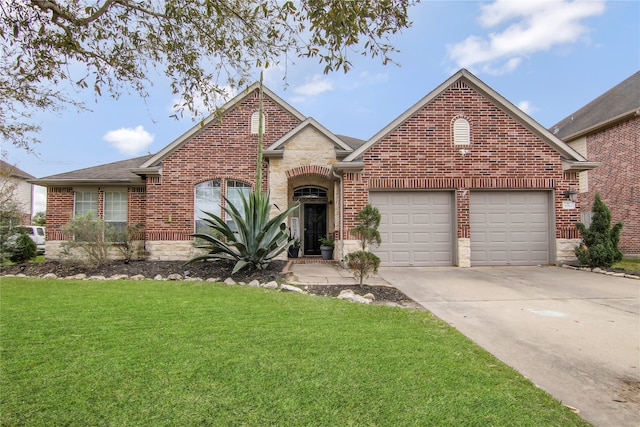 3014 Brahman Dr, Manvel, TX 77578 - traditional-style house with brick siding, a garage, driveway, and a front lawn