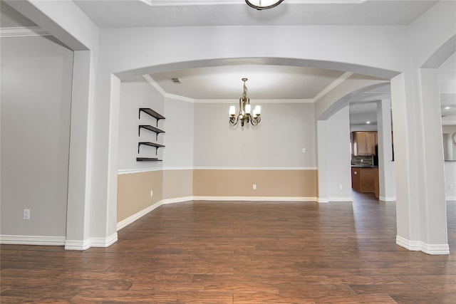 3014 Brahman Dr, Manvel, TX 77578 - empty room with dark wood-style floors, arched walkways, and crown molding