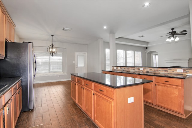 3014 Brahman Dr, Manvel, TX 77578 - kitchen with a center island, dark wood-style floors, baseboards, a ceiling fan, and recessed lighting