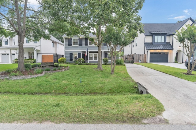 970 W 41st St, Houston, TX 77018 - view of front of home featuring driveway, a garage, and a standing seam roof