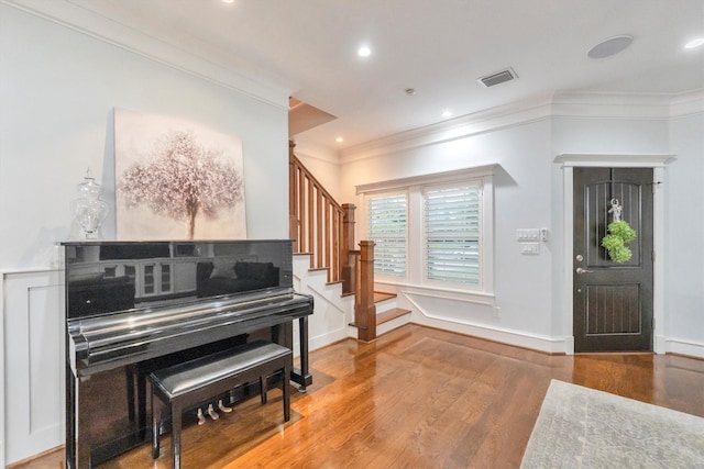 970 W 41st St, Houston, TX 77018 - foyer entrance with ornamental molding, wood finished floors, stairway, recessed lighting, and baseboards
