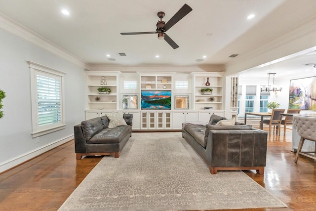 970 W 41st St, Houston, TX 77018 - living room with ornamental molding, a ceiling fan, a chandelier, wood finished floors, and recessed lighting