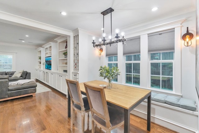 970 W 41st St, Houston, TX 77018 - dining room featuring wood finished floors, recessed lighting, a chandelier, and crown molding