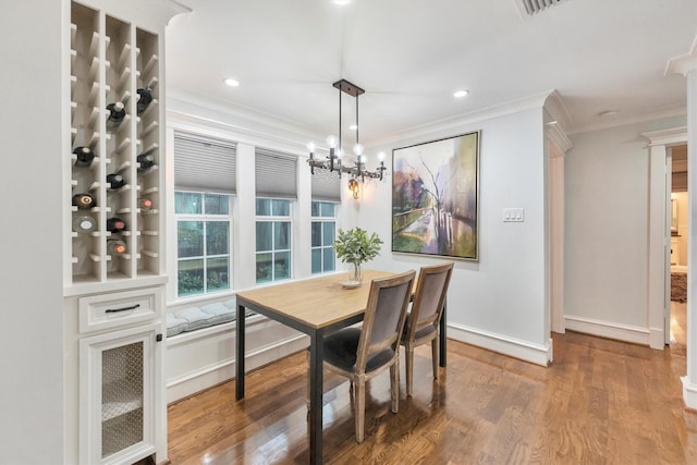 970 W 41st St, Houston, TX 77018 - dining area with crown molding, wood finished floors, a chandelier, baseboards, and recessed lighting