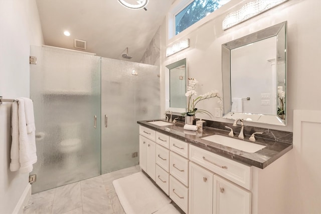 970 W 41st St, Houston, TX 77018 - bathroom featuring a stall shower, double vanity, and marble finish floors