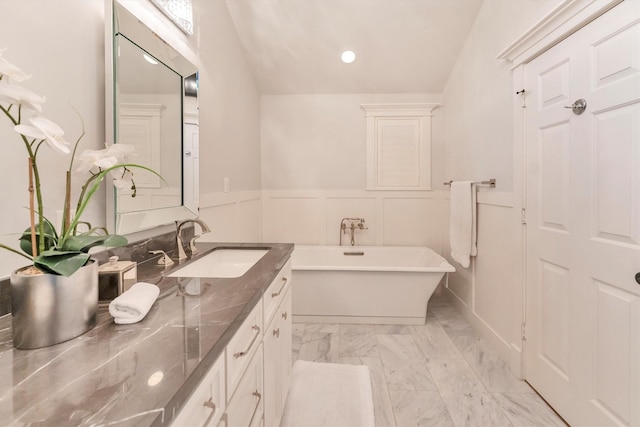970 W 41st St, Houston, TX 77018 - bathroom featuring vanity, marble finish flooring, a freestanding tub, wainscoting, and recessed lighting