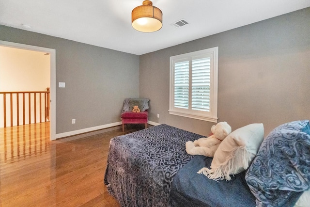 970 W 41st St, Houston, TX 77018 - bedroom with wood finished floors and baseboards