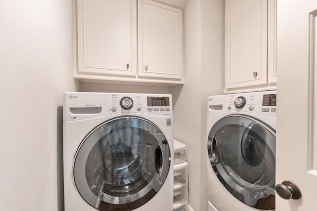 970 W 41st St, Houston, TX 77018 - washroom featuring separate washer and dryer and cabinet space