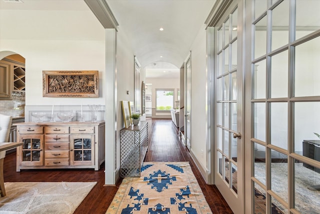 1243 Cheshire Ln, Houston, TX 77018 - hallway with arched walkways, french doors, and dark wood-style floors