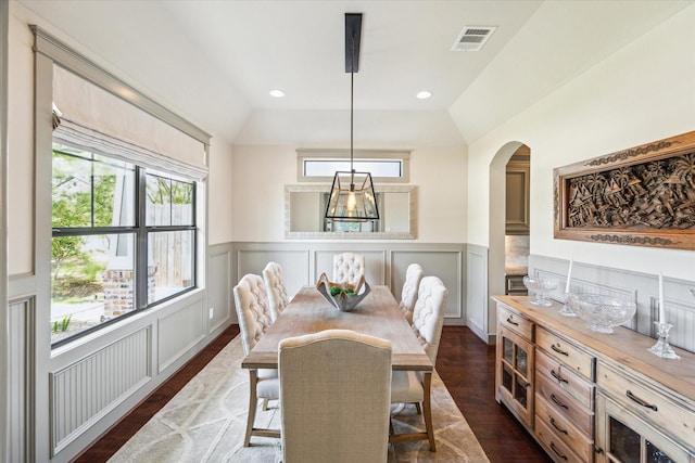 1243 Cheshire Ln, Houston, TX 77018 - dining area featuring dark wood-style flooring, arched walkways, a wainscoted wall, a decorative wall, and recessed lighting