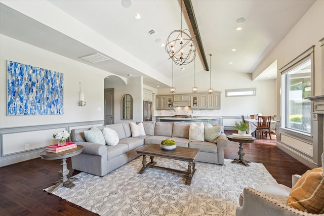 1243 Cheshire Ln, Houston, TX 77018 - living room featuring arched walkways, wood finished floors, a chandelier, beam ceiling, and recessed lighting