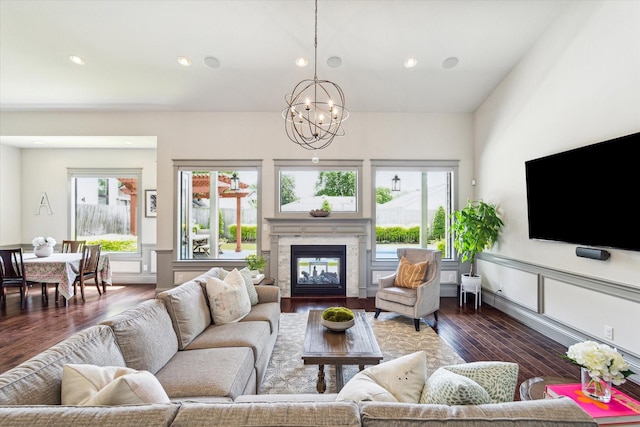 1243 Cheshire Ln, Houston, TX 77018 - living area with wood finished floors, a fireplace, a chandelier, and recessed lighting