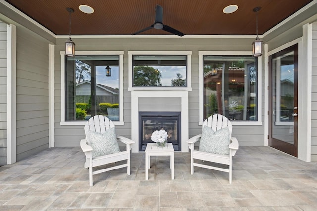 1243 Cheshire Ln, Houston, TX 77018 - view of patio / terrace with a fireplace and ceiling fan