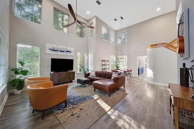 18 Heather Wisp Ct, Spring, TX 77381 - living room with a towering ceiling, wood finished floors, healthy amount of natural light, baseboards, and recessed lighting