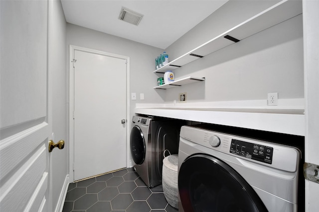 18 Heather Wisp Ct, Spring, TX 77381 - washroom featuring washing machine and dryer and dark tile patterned floors