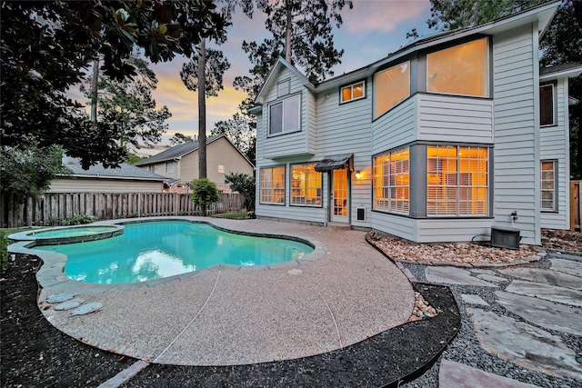 18 Heather Wisp Ct, Spring, TX 77381 - view of pool with a patio area, a fenced backyard, and a pool with connected hot tub
