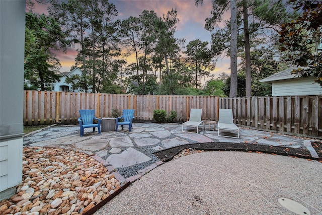 18 Heather Wisp Ct, Spring, TX 77381 - patio terrace at dusk with a patio area