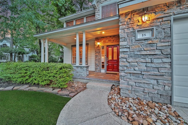 18 Heather Wisp Ct, Spring, TX 77381 - view of exterior entry featuring stone siding and a porch