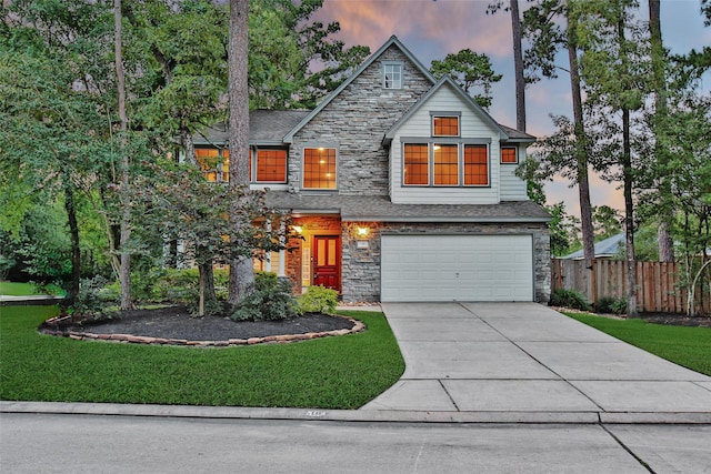18 Heather Wisp Ct, Spring, TX 77381 - view of front of property featuring stone siding, an attached garage, and driveway