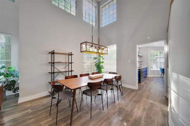 18 Heather Wisp Ct, Spring, TX 77381 - dining area featuring a high ceiling, wood finished floors, and baseboards
