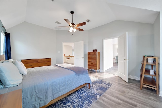 18 Heather Wisp Ct, Spring, TX 77381 - bedroom with vaulted ceiling, light wood-style flooring, a ceiling fan, and baseboards