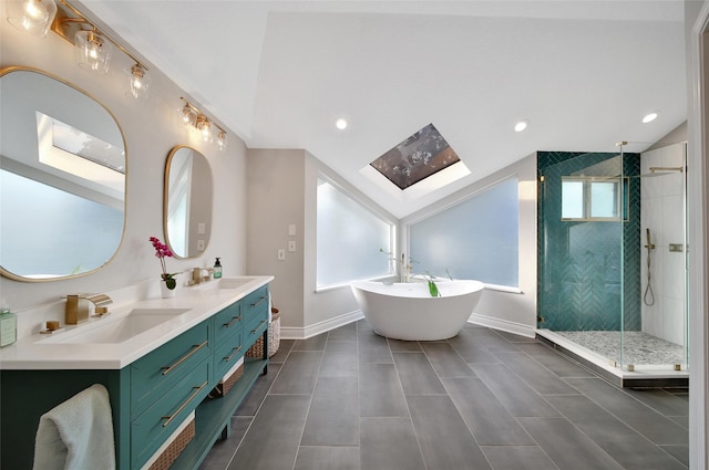 18 Heather Wisp Ct, Spring, TX 77381 - full bath featuring a skylight, baseboards, a stall shower, a soaking tub, and vaulted ceiling