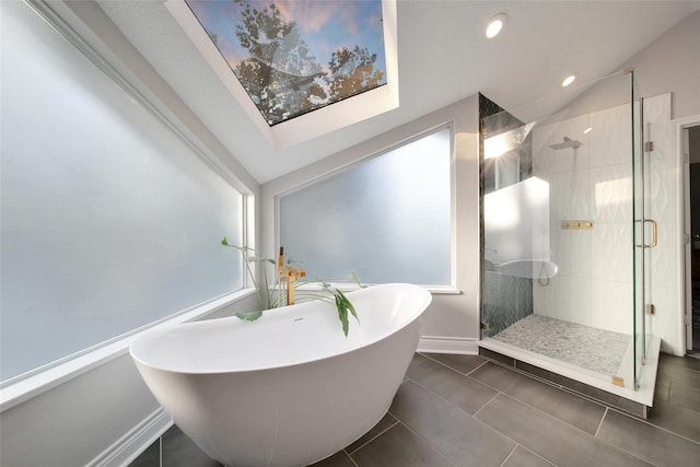 18 Heather Wisp Ct, Spring, TX 77381 - full bathroom with a freestanding tub, a shower stall, baseboards, recessed lighting, and tile patterned flooring