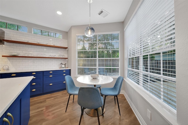 18 Heather Wisp Ct, Spring, TX 77381 - dining space with light wood-style flooring and baseboards