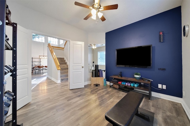 18 Heather Wisp Ct, Spring, TX 77381 - living room with ceiling fan, stairway, wood finished floors, and healthy amount of natural light