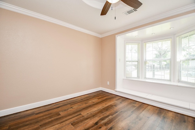 1117 King St, Houston, TX 77022 - empty room featuring dark wood-type flooring, ceiling fan, ornamental molding, and baseboards