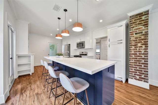 724 E 21st St, Houston, TX 77008 - kitchen with appliances with stainless steel finishes, baseboards, white cabinetry, crown molding, and a sink