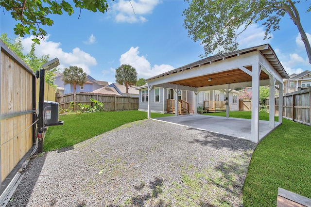 724 E 21st St, Houston, TX 77008 - view of yard featuring a carport, cooling unit, a patio, and gravel driveway