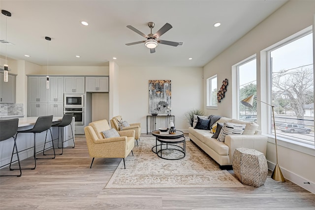 2905 Nagle St, Houston, TX 77004 - living room featuring a ceiling fan, light wood-style flooring, and recessed lighting