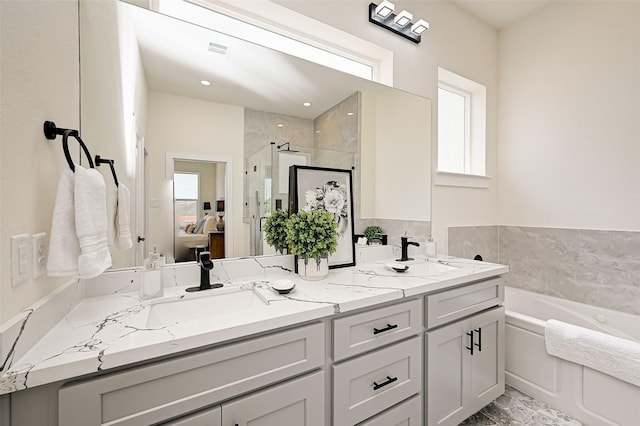 2905 Nagle St, Houston, TX 77004 - bathroom featuring a stall shower, a bath, and double vanity
