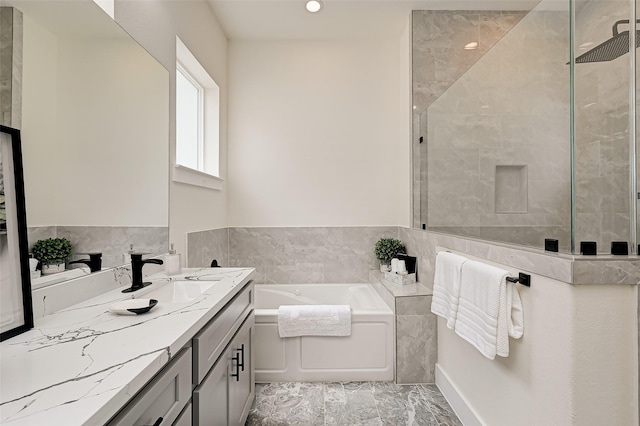 2905 Nagle St, Houston, TX 77004 - bathroom with a bath, vanity, a tile shower, tile walls, and recessed lighting