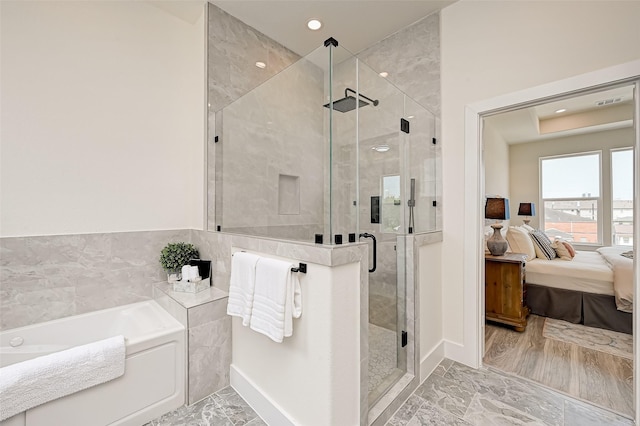 2905 Nagle St, Houston, TX 77004 - full bathroom with a bath, connected bathroom, marble finish floors, a stall shower, and recessed lighting