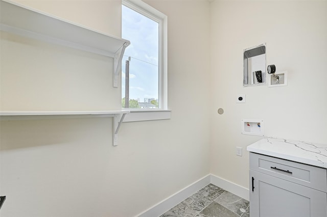 2905 Nagle St, Houston, TX 77004 - laundry area featuring electric dryer hookup, baseboards, hookup for a washing machine, and cabinet space