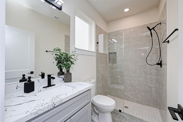 2905 Nagle St, Houston, TX 77004 - bathroom featuring vanity, toilet, a tile shower, and recessed lighting