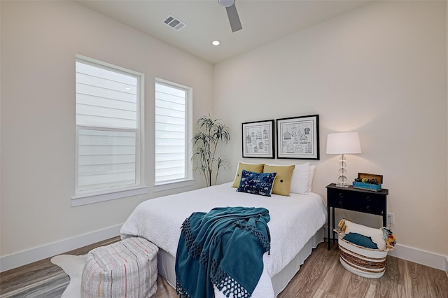 2905 Nagle St, Houston, TX 77004 - bedroom featuring baseboards, multiple windows, and wood finished floors
