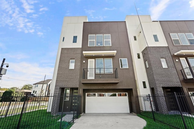 2905 Nagle St, Houston, TX 77004 - view of property featuring concrete driveway, stucco siding, and a garage