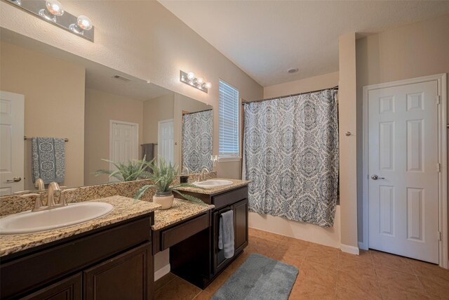 4323 N Vineyard Mdw Ln, Katy, TX 77449 - full bath featuring double vanity, tile patterned floors, and shower / bath combo