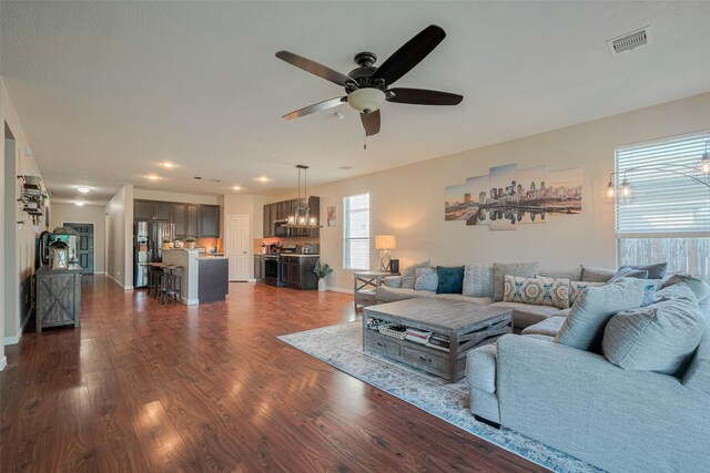4323 N Vineyard Mdw Ln, Katy, TX 77449 - living area featuring a ceiling fan, a chandelier, dark wood finished floors, baseboards, and recessed lighting